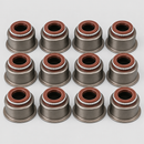 Twelve valve stem seals on light gray background